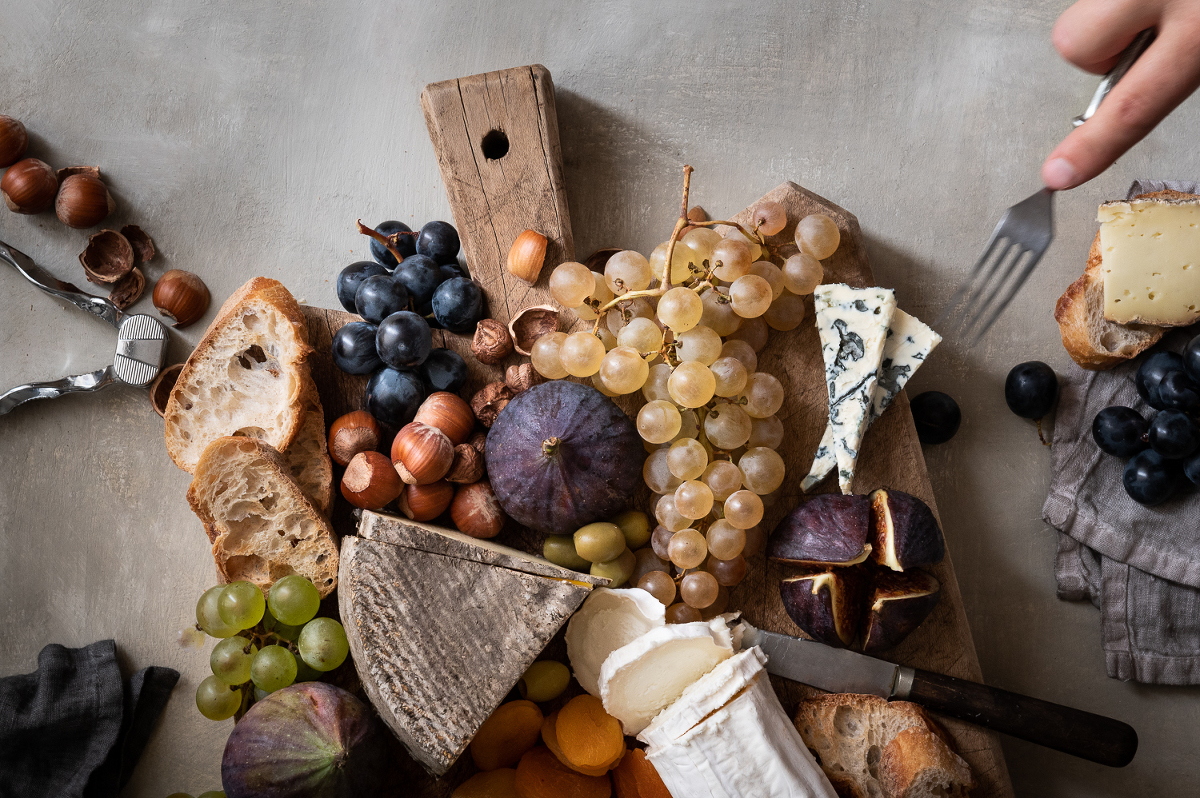 Cheese board and chasselas grapes