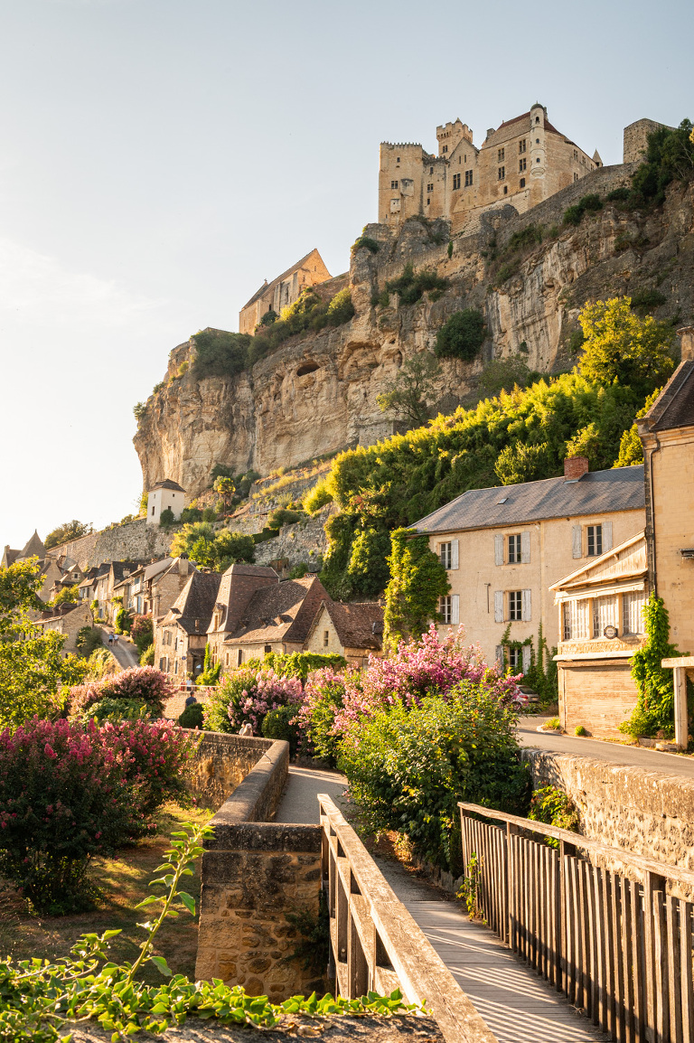 Beynac et Cazenac in the Dordogne from the waterfront at dawn.