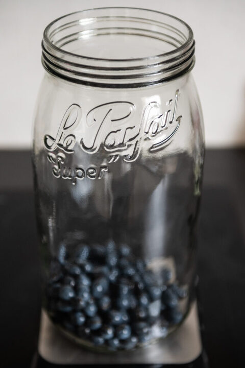 measuring sloe berries for gin recipe