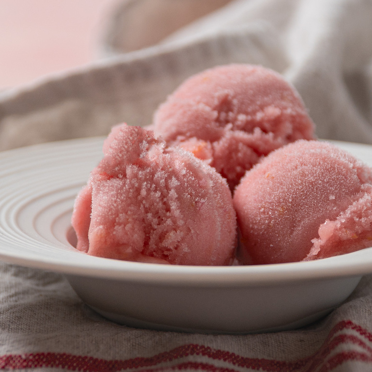 close up image of rhubarb elderflower sorbet