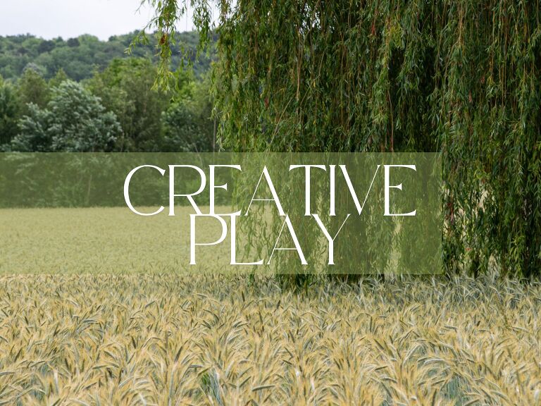 header image of a grain field with a weeping willow and tree in the foreground and trees in the background. An exploration of creative play
